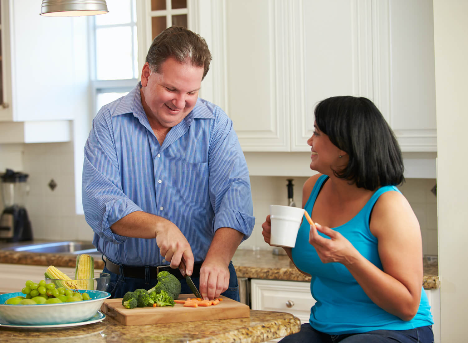 Overweight,Couple,On,Diet,Preparing,Vegetables,In,Kitchen