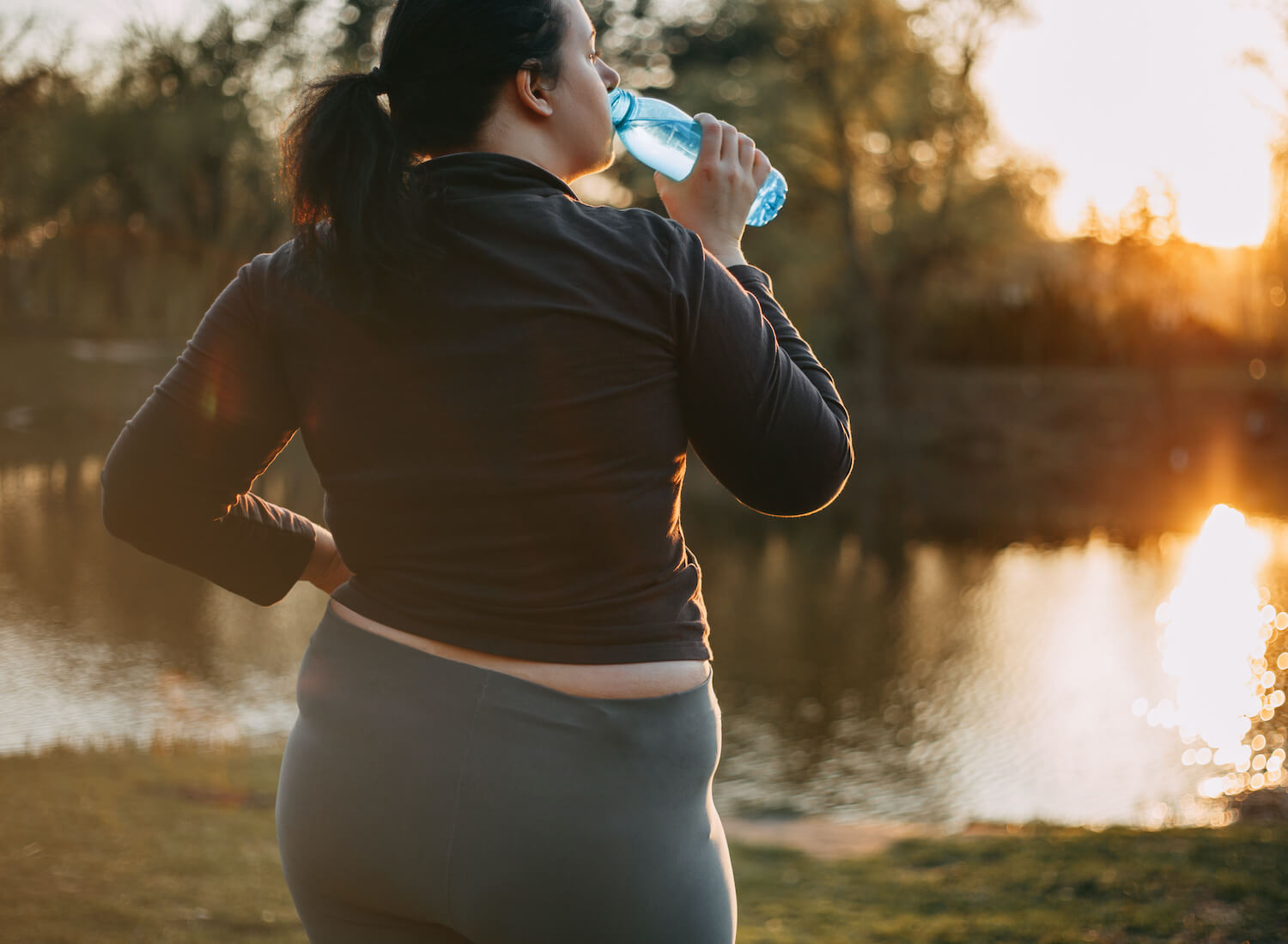 Overweight,Woman,Drink,Water,During,Morning,Walk.,Copy,Space.,Healthy Reflux