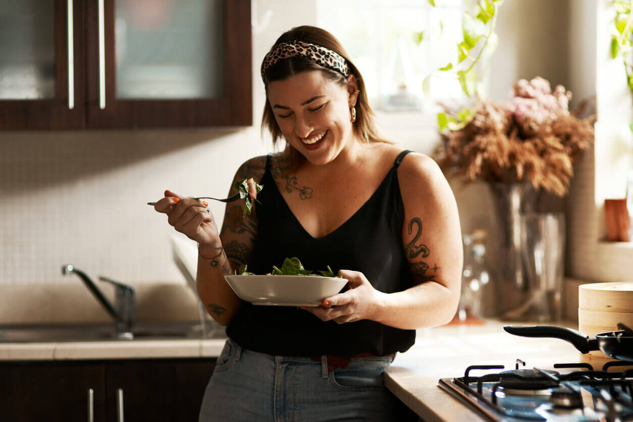 woman with tattoos eating salad Dr Jason Maani